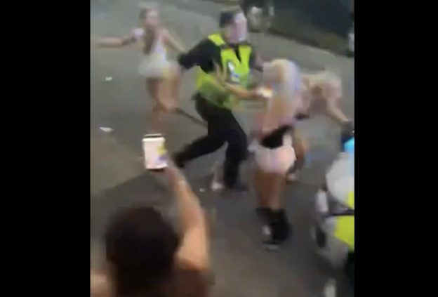 Pig beats young girls with police baton.
